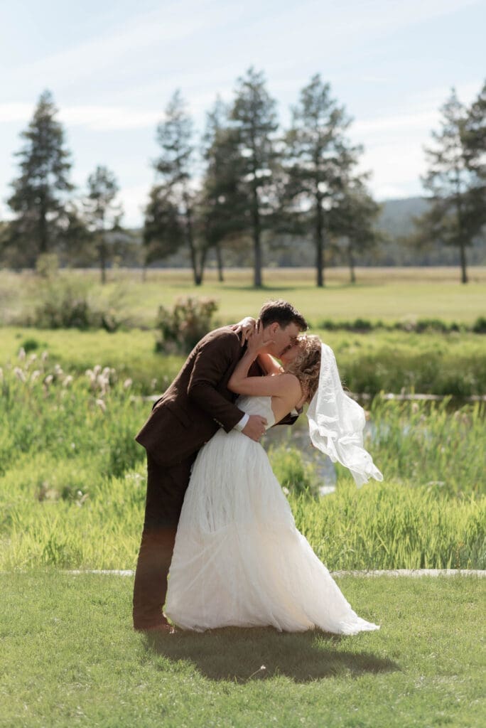 Candid wedding portrait of bride and groom in Sun River.